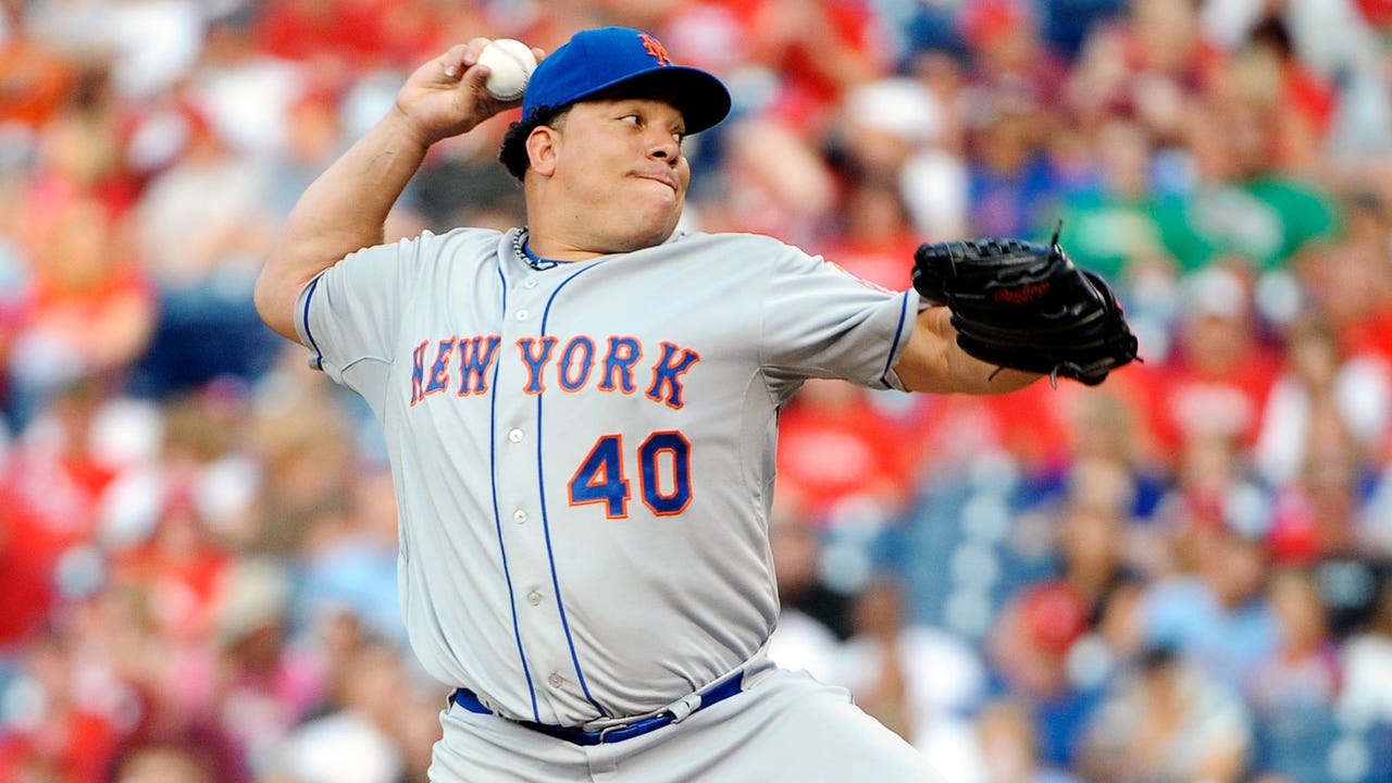 Colon joins 200-victory club, Mets hang on to edge Phillies